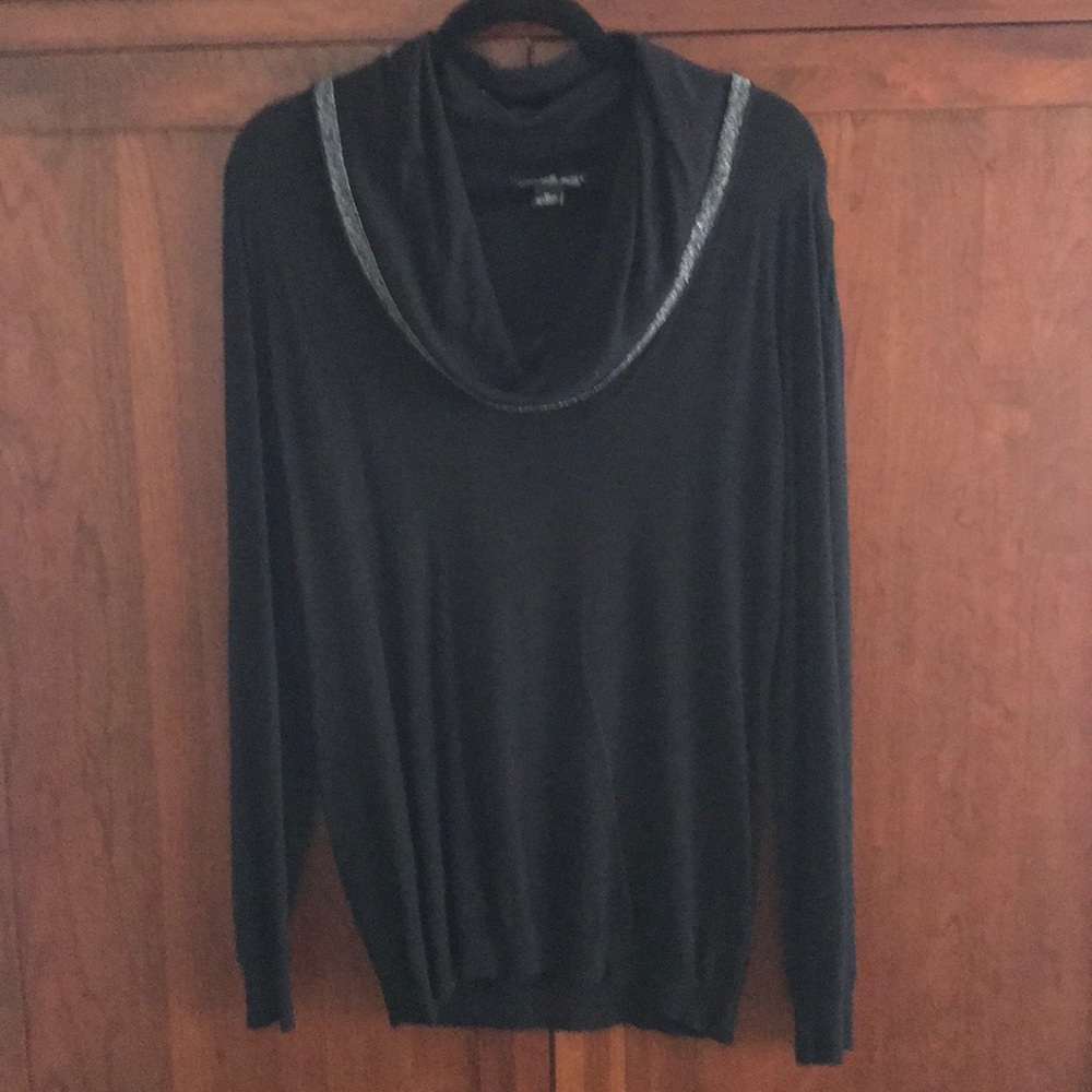 Cowl neck sweater with silver trim.